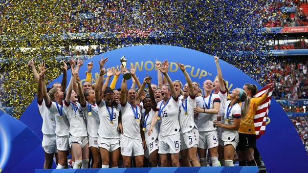USA's players celebrate with the trophy after the France 2019 Women’s World Cup football final match between USA and the Netherlands, on July 7, 2019, at the Lyon Stadium in Lyon, central-eastern France. (AFP) USA's players celebrate with the trophy after the France 2019 Women’s World Cup football final match between USA and the Netherlands, on July 7, 2019, at the Lyon Stadium in Lyon, central-eastern France. (AFP)