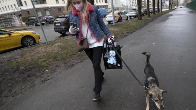 Medvedeva walks Barly to meet Alexandra Novatova. Medvedeva’s project wants to make sure that the animals aren’t adopted just as a temporary salve to the tedium and loneliness of lockdown. (Alexander Zemlianichenko / AP) Medvedeva walks Barly to meet Alexandra Novatova. Medvedeva’s project wants to make sure that the animals aren’t adopted just as a temporary salve to the tedium and loneliness of lockdown. (Alexander Zemlianichenko / AP)