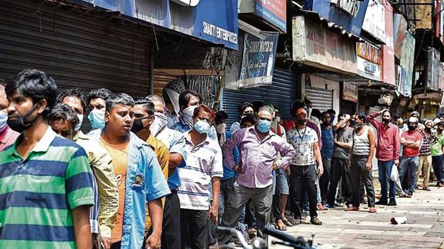 Throwing social distancing norms to the wind after 40 dry days, people wait in a long queue outside a liquor shop in Daryaganj, New Delhi, on Monday. (Arvind Yadav/HT Photo) Throwing social distancing norms to the wind after 40 dry days, people wait in a long queue outside a liquor shop in Daryaganj, New Delhi, on Monday. (Arvind Yadav/HT Photo)