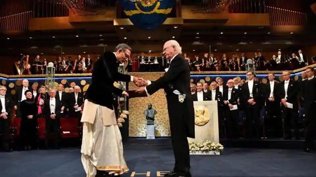 Indian-American economist Abhijit Banerjee shakes hands with Sweden’s King Carl Gustaf as he receives the Economic Nobel at a ceremony in Stockholm, on December 10.(Reuters Photo) Indian-American economist Abhijit Banerjee shakes hands with Sweden’s King Carl Gustaf as he receives the Economic Nobel at a ceremony in Stockholm, on December 10.(Reuters Photo)