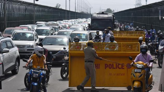 Traffic moving slowly as Delhi Police and traffic personnel screen commuters at Yamuna Flyover on Vikas Marg in New Delhi Monday. (Raj K Raj/HT File Photo) Traffic moving slowly as Delhi Police and traffic personnel screen commuters at Yamuna Flyover on Vikas Marg in New Delhi Monday. (Raj K Raj/HT File Photo)