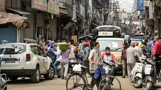 Commuters out on a road in Sabun Bazaar area of Old City in Ludhiana on Tuesday. (Gurpreet Singh/HT) Commuters out on a road in Sabun Bazaar area of Old City in Ludhiana on Tuesday. (Gurpreet Singh/HT)