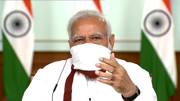 Prime Minister Narendra Modi seen wearing a mask during video-conferencing with the chief ministers over Covid-19. (ANI Photo) Prime Minister Narendra Modi seen wearing a mask during video-conferencing with the chief ministers over Covid-19. (ANI Photo)