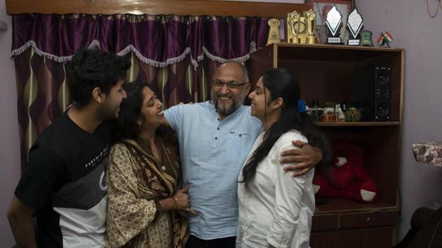 Associated Press photographer Channi Anand celebrates with his family following the announcement that he was one of three AP photographers who won the Pulitzer Prize in Feature Photography for their coverage of the conflict in Kashmir, India. (AP Photo)