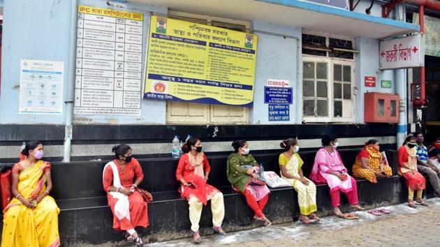 Women wearing protective masks wait for treatment at a local government hospital after some departments of the hospital opened as lockdown restrictions were lifted, in Kolkata on Monday. (ANI Photo) Women wearing protective masks wait for treatment at a local government hospital after some departments of the hospital opened as lockdown restrictions were lifted, in Kolkata on Monday. (ANI Photo)