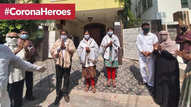 The image shows the doctor family standing in front of their house.(HT Photo)