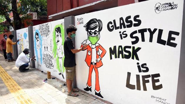 Artists draw a graffiti of Covid-19 awareness cartoons on the wall of the Ernakulam General Hospital in Kochi on Tuesday. (ANI Photo) Artists draw a graffiti of Covid-19 awareness cartoons on the wall of the Ernakulam General Hospital in Kochi on Tuesday. (ANI Photo)