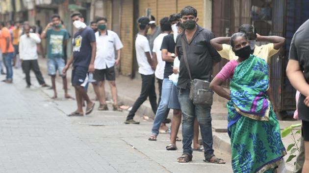 People queue to buy liquor outside a wine store at Worli, after it was allowed to open in all except containment zones in Mumbai on Tuesday. (Satish Bate/HT Photo) People queue to buy liquor outside a wine store at Worli, after it was allowed to open in all except containment zones in Mumbai on Tuesday. (Satish Bate/HT Photo)