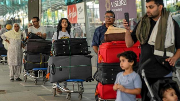 Canadian nationals queue to check-in before boarding a special flight for New Delhi. (AFP) Canadian nationals queue to check-in before boarding a special flight for New Delhi. (AFP)