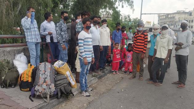 Migrant workers hailing from Jharkhand gathered outside the Ludhiana railway station in anticipation of a train to take them home on Tuesday. (Gurpreet Singh/HT) Migrant workers hailing from Jharkhand gathered outside the Ludhiana railway station in anticipation of a train to take them home on Tuesday. (Gurpreet Singh/HT)
