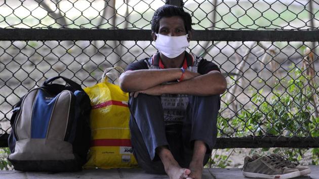 A migrant man with luggage on the roadside near Mahamaya flyover Sector 44, in Noida on Tuesday. (Sunil Ghosh /HT Photo) A migrant man with luggage on the roadside near Mahamaya flyover Sector 44, in Noida on Tuesday. (Sunil Ghosh /HT Photo)