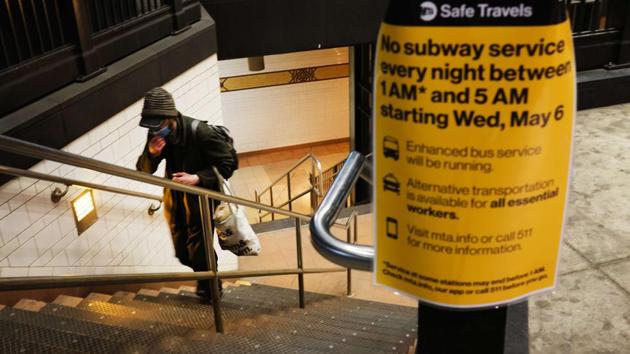Signs are posted outside of Brooklyn station as workers prepare to close down the New York City subway system, the largest public transportation system in the nation, for nightly cleaning due to the continued spread of the coronavirus on May 5 in New York City. (Spencer Platt /Getty Images /AFP)