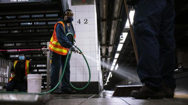 Workers clean Grand Central station on May 6 in New York City. (Eduardo Munoz Alvarez / Getty Images /AFP)