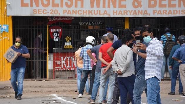 Customers can be seen queueing up outside liquor shops which opened after a gap of 40 days on Wednesday in Panchkula. (Sant Arora/HT) Customers can be seen queueing up outside liquor shops which opened after a gap of 40 days on Wednesday in Panchkula. (Sant Arora/HT)