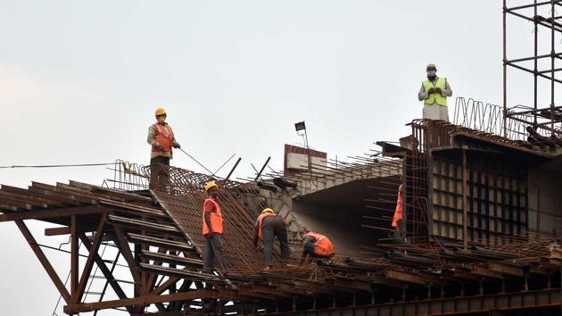 Labourers working on an under construction flyover after relaxations in lockdown conditions at Bailey road in Patna, Bihar. (Parwaz Khan/HT Photo) Labourers working on an under construction flyover after relaxations in lockdown conditions at Bailey road in Patna, Bihar. (Parwaz Khan/HT Photo)
