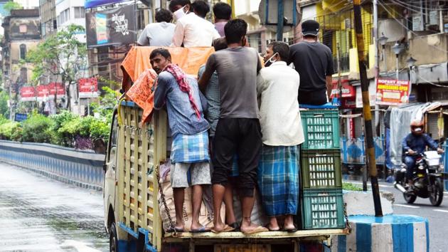 Vegetable vendors ride in a truck as they going to market, in Kolkata on Wednesday. (ANI Photo) (ANI) Vegetable vendors ride in a truck as they going to market, in Kolkata on Wednesday. (ANI Photo) (ANI)