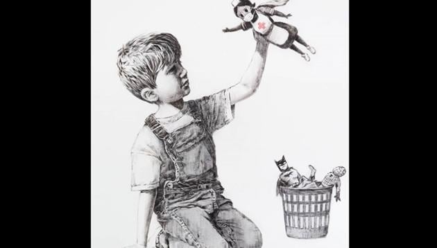 The artwork shows a little boy with a nurse superhero toy.(Instagram/@banksy)
