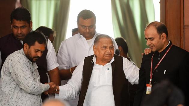 SP leader Mulayam Singh Yadav is assisted by others during the budget session in Parliament, in New Delhi, on March 6, 2020.(Mohd Zakir/HT file photo)
