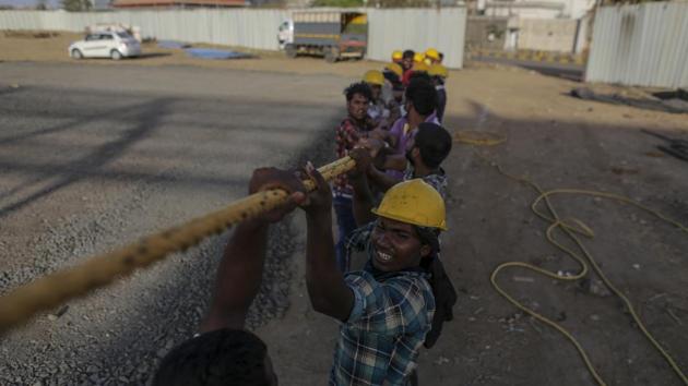Workers pull on a high-tension rope during the construction of a 1,000 bed hospital for Covid-19 treatment at the Bandra Kurla Complex exhibition ground. On Thursday, May 7, the financial capital reported 692 infections, taking its case count to 11, 219. (Dhiraj Singh / Bloomberg) Workers pull on a high-tension rope during the construction of a 1,000 bed hospital for Covid-19 treatment at the Bandra Kurla Complex exhibition ground. On Thursday, May 7, the financial capital reported 692 infections, taking its case count to 11, 219. (Dhiraj Singh / Bloomberg)