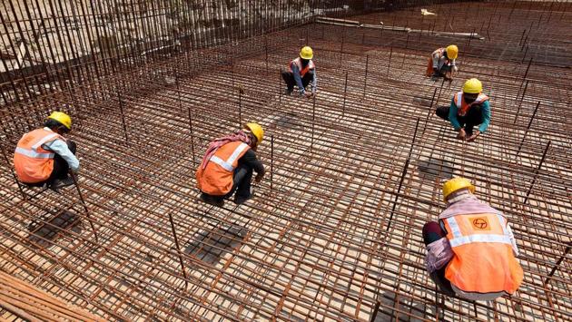 Employees of Larsen & Toubro (L&T) seen at a construction site in Pragati Maidan after the lockdown restrictions were eased. Delhi Chief Minister, Arvind Kejriwal said on Sunday that a complete lockdown has affected the economy and livelihood of people and relaxations were important to ensure life is not completely thrown out of gear. (Biplov Bhuyan / HT Photo) Employees of Larsen & Toubro (L&T) seen at a construction site in Pragati Maidan after the lockdown restrictions were eased. Delhi Chief Minister, Arvind Kejriwal said on Sunday that a complete lockdown has affected the economy and livelihood of people and relaxations were important to ensure life is not completely thrown out of gear. (Biplov Bhuyan / HT Photo)