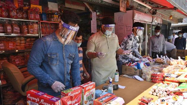 Shopkeepers and staff seen wearing face shields at a departmental store in Vasant Vihar market.“Now, most people from the community – many without any symptoms – are being tested positive. This could be the second generation of transmission from the travellers that we might have missed and soon we will see the third generation of transmission, with the relaxation in norms,” a district official told HT. (Ajay Aggarwal / HT Photo) Shopkeepers and staff seen wearing face shields at a departmental store in Vasant Vihar market.“Now, most people from the community – many without any symptoms – are being tested positive. This could be the second generation of transmission from the travellers that we might have missed and soon we will see the third generation of transmission, with the relaxation in norms,” a district official told HT. (Ajay Aggarwal / HT Photo)