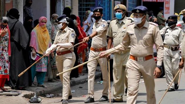 Police officers advise women in Ahmedabad to maintain distance as they wait to collect grocery during an extended nationwide lockdown to slow the spreading of coronavirus disease. (Reuters File Photo) Police officers advise women in Ahmedabad to maintain distance as they wait to collect grocery during an extended nationwide lockdown to slow the spreading of coronavirus disease. (Reuters File Photo)