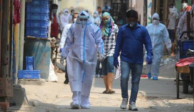 Gurugram, India- May 05, 2020: Medical workers in PPE overalls during a screening exercise in Sirhaul village during a nationwide lockdown due to coronavirus pandemic, at Sirhaul village. (Yogendra Kumar/HT PHOTO) Gurugram, India- May 05, 2020: Medical workers in PPE overalls during a screening exercise in Sirhaul village during a nationwide lockdown due to coronavirus pandemic, at Sirhaul village. (Yogendra Kumar/HT PHOTO)