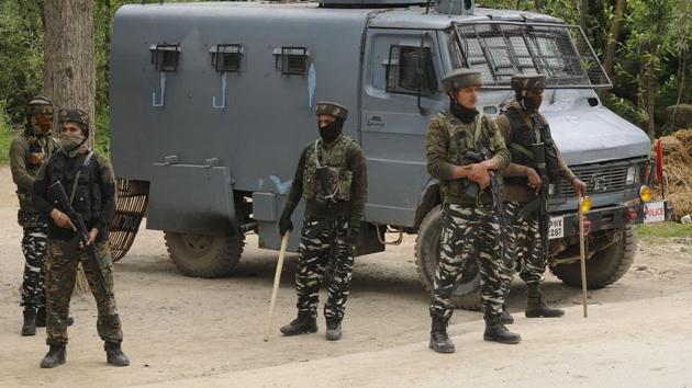 Security forces near the site of a gunfight in which Hizbul Mujahideen commander Riyaz Naikoo along with an associate were killed, in Beighpora area, Pulwama district, Jammu and Kashmir on Wednesday.(Waseem Andrabi/HT Photo) Security forces near the site of a gunfight in which Hizbul Mujahideen commander Riyaz Naikoo along with an associate were killed, in Beighpora area, Pulwama district, Jammu and Kashmir on Wednesday.(Waseem Andrabi/HT Photo)