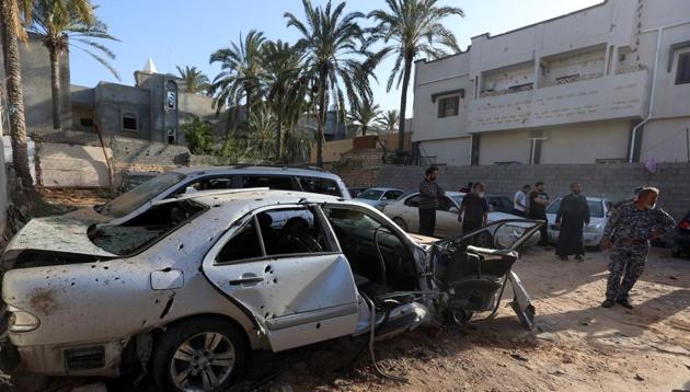 Libyans check the site of shelling on the residential area of souq al-Gomaa, north of the Libyan capital Tripoli, on April 17, 2020.(AFP photo)