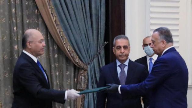 Iraq's President Barham Salih instrcuts newly appointed Prime Minister Mustafa al-Kadhimi in Baghdad, Iraq April 9, 2020. (Reuters) Iraq's President Barham Salih instrcuts newly appointed Prime Minister Mustafa al-Kadhimi in Baghdad, Iraq April 9, 2020. (Reuters)