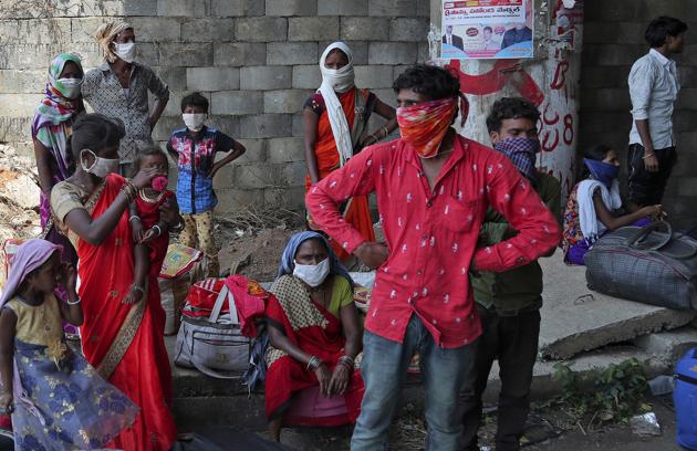 Migrant workers from the neighboring state of Maharashtra trying to return to their villages hundreds of miles away take a break as they walk during a nationwide lockdown to curb the spread of new coronavirus on the outskirts of Hyderabad. (AP) Migrant workers from the neighboring state of Maharashtra trying to return to their villages hundreds of miles away take a break as they walk during a nationwide lockdown to curb the spread of new coronavirus on the outskirts of Hyderabad. (AP)