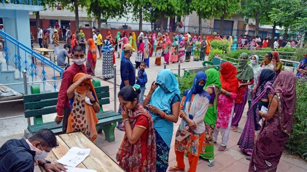 Women stand in a queue while maintaining social distancing as they apply for new ration card, at Jagdish Pura in Agra on Tuesday.(ANI Photo)