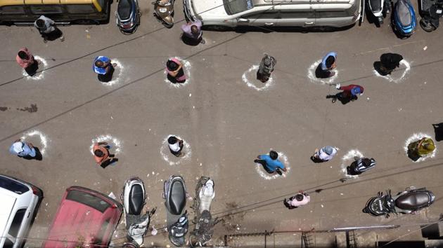 People stand inside marked circles for proper adherence of social distancing at a ration distribution centre in Dharavi. Chief Minister Uddhav Thackeray has been in touch with central government agencies, including the Armed Forces, Railways and Mumbai Port Trust on the availability of hospitals in Mumbai, Pune and other cities “as part of preparedness”. (Satish Bate / HT Photo) People stand inside marked circles for proper adherence of social distancing at a ration distribution centre in Dharavi. Chief Minister Uddhav Thackeray has been in touch with central government agencies, including the Armed Forces, Railways and Mumbai Port Trust on the availability of hospitals in Mumbai, Pune and other cities “as part of preparedness”. (Satish Bate / HT Photo)