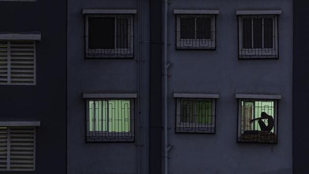 A person sits by the window of their room in a COVID-19 quarantine centre during the lockdown in Mumbai. The city worst hit by the pandemic in the country, recorded 17,974 cases by the end of Thursday. (Kunal Patil / PTI) A person sits by the window of their room in a COVID-19 quarantine centre during the lockdown in Mumbai. The city worst hit by the pandemic in the country, recorded 17,974 cases by the end of Thursday. (Kunal Patil / PTI)