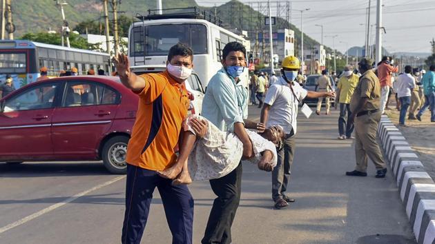 Visakhapatnam: An unconscious woman affected by styrene vapour leak from a polymer plant, being carried to a hospital for treatment, in Visakhapatnam.(PTI Photo)