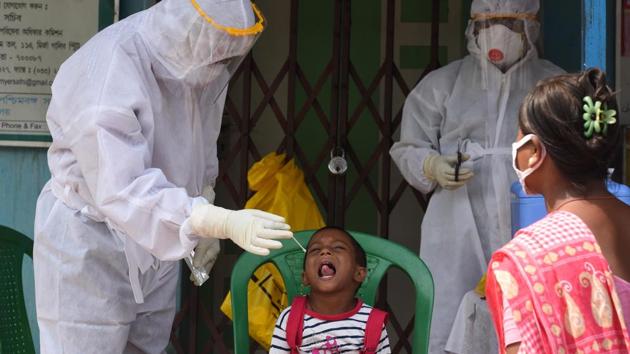 Medics in PPE suits take a swab sample for Covid-19 testing at Muchibazar, ward 13 of Kolkata Municipal Corporation (KMC) in Kolkata (Photo by Samir Jana / Hindustan Times)