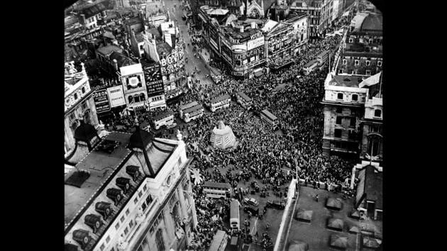 In this May 8, 1945 file photo a crowd gathers to celebrate VE Day in Piccadilly Circus in London, England. On Friday's 75th anniversary of the end of World War II in Europe, a different kind of war is at hand — this time against a disease that has killed at least a quarter of a million people worldwide. (AP File)