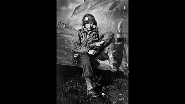 This 1945 photo shows photographer PFC Tony Vaccaro on the wing of an airplane during WWII. Vaccaro, 97, was thrown into WWII with the 83rd Infantry division which fought, like Charles Shay, in Normandy, and then came to Schmetz's doorstep for the Battle of the Bulge. (Tony Vaccaro via AP)