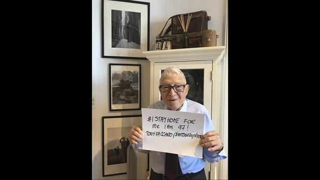 Tony Vaccaro poses for a photo at his studio in Long Island City in the Queens borough of New York in this image from March 21. Vaccaro, 97, fought WWII as part of the 83rd Infantry division in Normandy. On top of his military gear, he also carried a camera, and became a fashion and celebrity photographer after the war. COVID-19 caught up with him last month. Like everything bad life threw at him, he shook it off, attributing his survival to plain "fortune." (Maria Vaccaro via AP)
