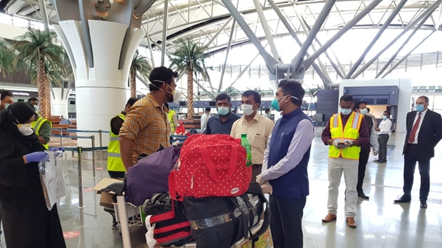 Indian ambassador Munu Mahawar interacting with Indians on first flight from Muscat to Kochi.(HT Photo/ MEA) Indian ambassador Munu Mahawar interacting with Indians on first flight from Muscat to Kochi.(HT Photo/ MEA)
