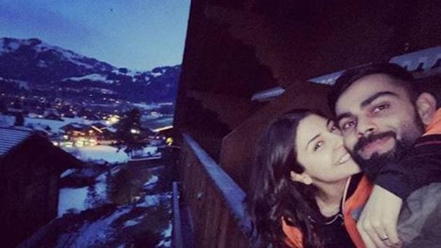 Peck it out! Virat Kohli and Anushka Sharma lock it with love