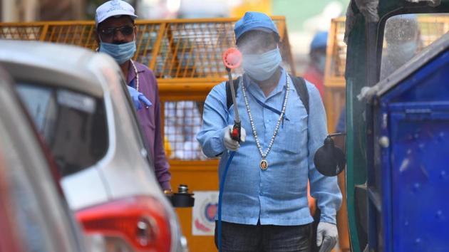 East Delhi Municipal Corporation (EDMC) workers on sanitization drive of a containment zone in Pandav Nagar, New Delhi on Friday.(Raj K Raj/HT PHOTO)