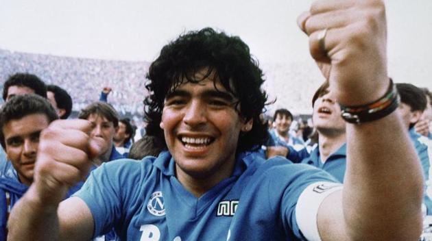 Diego Maradona cheers after the Napoli team clinches its first Italian major league title in Naples.(Meazza Sambucetti/AP/Shutterstock)