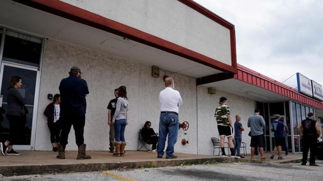 People who lost their jobs wait in line to file for unemployment following an outbreak of the coronavirus disease at an Arkansas Workforce Center in Fayetteville, Arkansas, US on April 6, 2020.(Reuters File Photo)