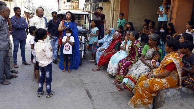 Vaishali Patkar, from Aundh Vikas Mandal volunteered to help domestic workers and locals understand Covid-19, to help curtail misinformation in Pune. Altruism is not a strong enough force to protect the interests of workers, who constitute some of the most vulnerable and marginalised sections of society(Rahul Raut/HT PHOTO)