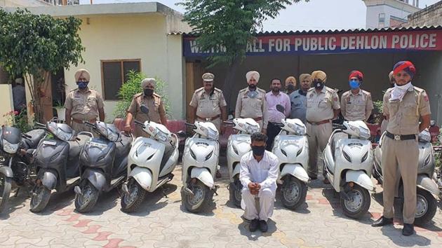 The accused in Dehlon police custody in Ludhiana on Saturday. Cops have also recovered seven other stolen scooters, two motorcycles and a sharp-edged weapon from his possession. His accomplice is yet to be arrested. (HT PHOTO) The accused in Dehlon police custody in Ludhiana on Saturday. Cops have also recovered seven other stolen scooters, two motorcycles and a sharp-edged weapon from his possession. His accomplice is yet to be arrested. (HT PHOTO)