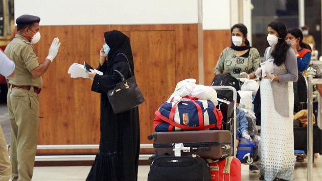 Stranded passangers being screened as they check out from the Kochi International Airport as they arrive from Abu Dhabi by special Air India Express flight in Kochi on Friday.(ANI Photo) Stranded passangers being screened as they check out from the Kochi International Airport as they arrive from Abu Dhabi by special Air India Express flight in Kochi on Friday.(ANI Photo)