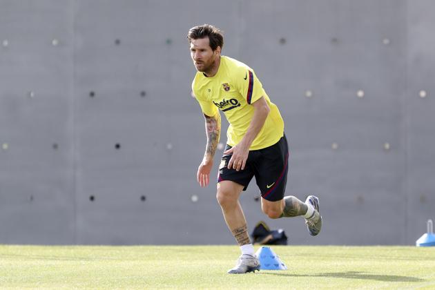 In this photo provided by FC Barcelona, Lionel Messi trains in Barcelona, Spain, on Friday May 8, 2020. Soccer players in Spain returned to train for the first time since the country entered a lockdown nearly two months ago because of the coronavirus pandemic. (Miguel Ruiz/FC Barcelona via AP) (AP) In this photo provided by FC Barcelona, Lionel Messi trains in Barcelona, Spain, on Friday May 8, 2020. Soccer players in Spain returned to train for the first time since the country entered a lockdown nearly two months ago because of the coronavirus pandemic. (Miguel Ruiz/FC Barcelona via AP) (AP)