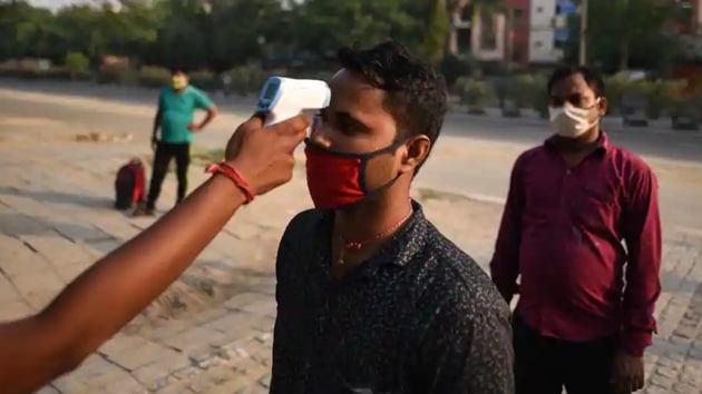 A migrant worker undergoes thermal screening at Delhi’s Yamuna Sports Complex which turned into a shelter home, during nationwide lockdown to curb the spread of coronavirus. (Biplov Bhuyan/ HT file photo) A migrant worker undergoes thermal screening at Delhi’s Yamuna Sports Complex which turned into a shelter home, during nationwide lockdown to curb the spread of coronavirus. (Biplov Bhuyan/ HT file photo)