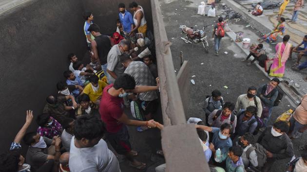 Scene from inside a truck between Thane and Bhiwandi as migrant workers jump in, hoping to make their back to Uttar Pradesh, to their villages, on May 9. (Satish Bate / HT Photo) Scene from inside a truck between Thane and Bhiwandi as migrant workers jump in, hoping to make their back to Uttar Pradesh, to their villages, on May 9. (Satish Bate / HT Photo)